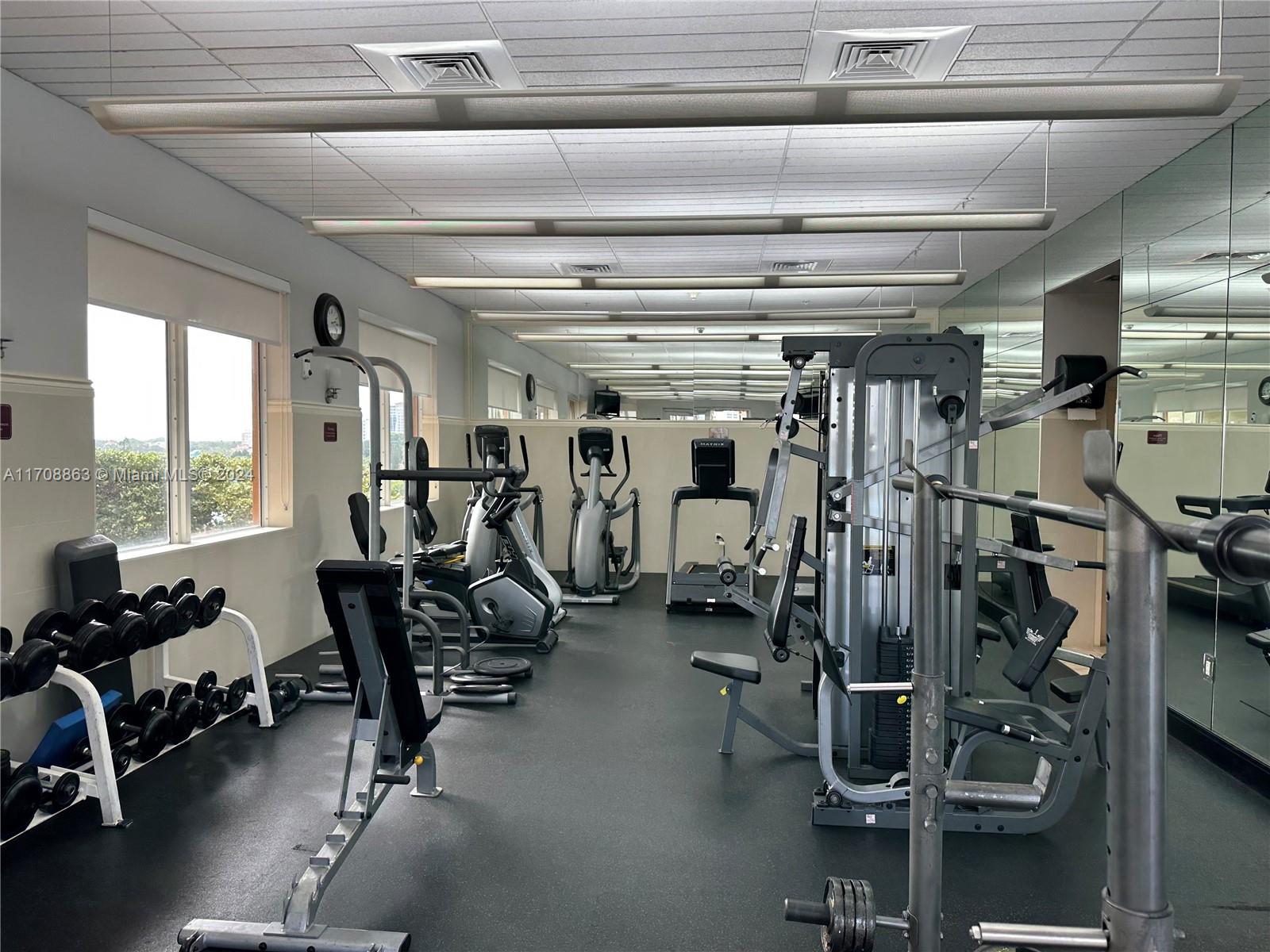 3232 Southwest 22nd Terrace, Unit 1903 Miami, FL 33145 - Photo 27 of 30 a view of a room with gym equipment