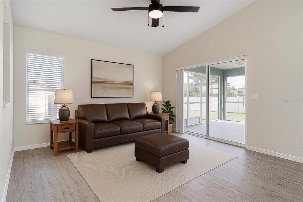 108 Brittany Road Mascotte, FL 34753 - Photo 11 of 23 a living room with furniture and a window