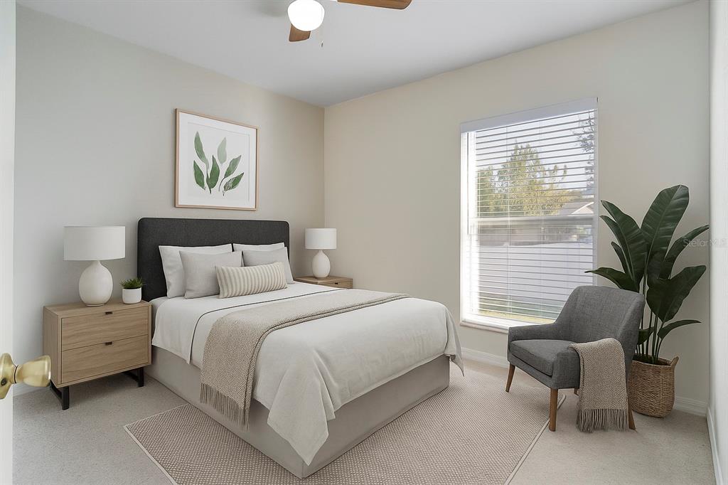 108 Brittany Road Mascotte, FL 34753 - Photo 12 of 23 a bedroom with a bed and a potted plant