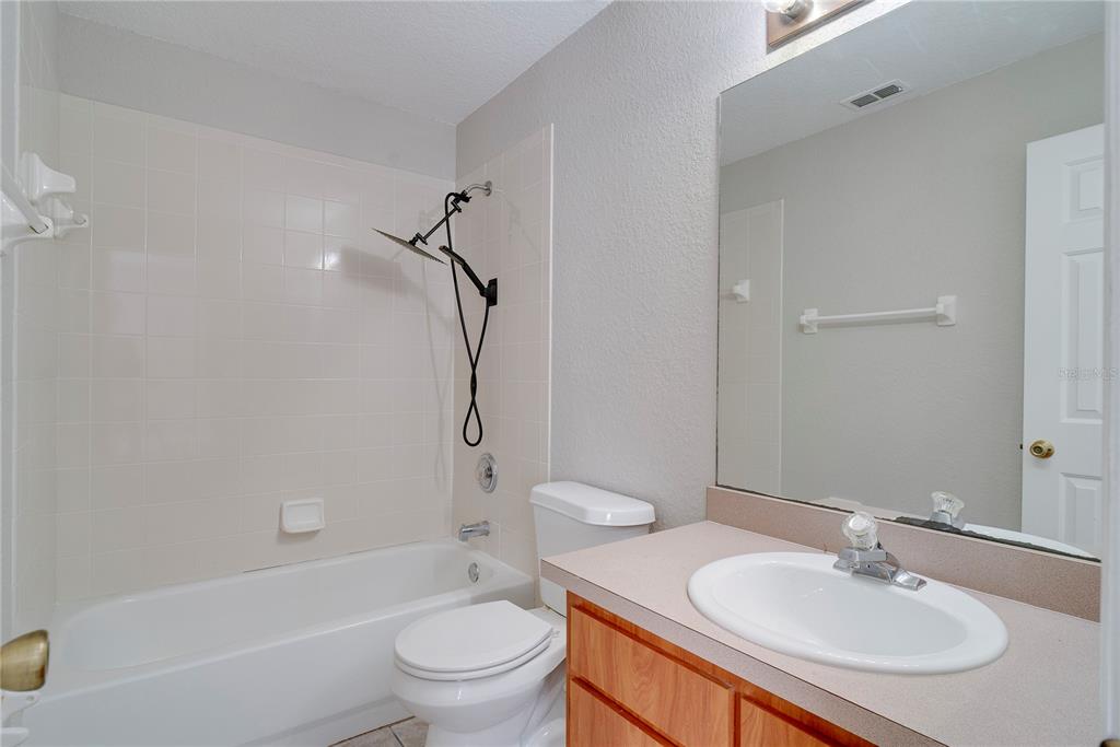 108 Brittany Road Mascotte, FL 34753 - Photo 6 of 23 a bathroom with a sink toilet tub vanity and shower