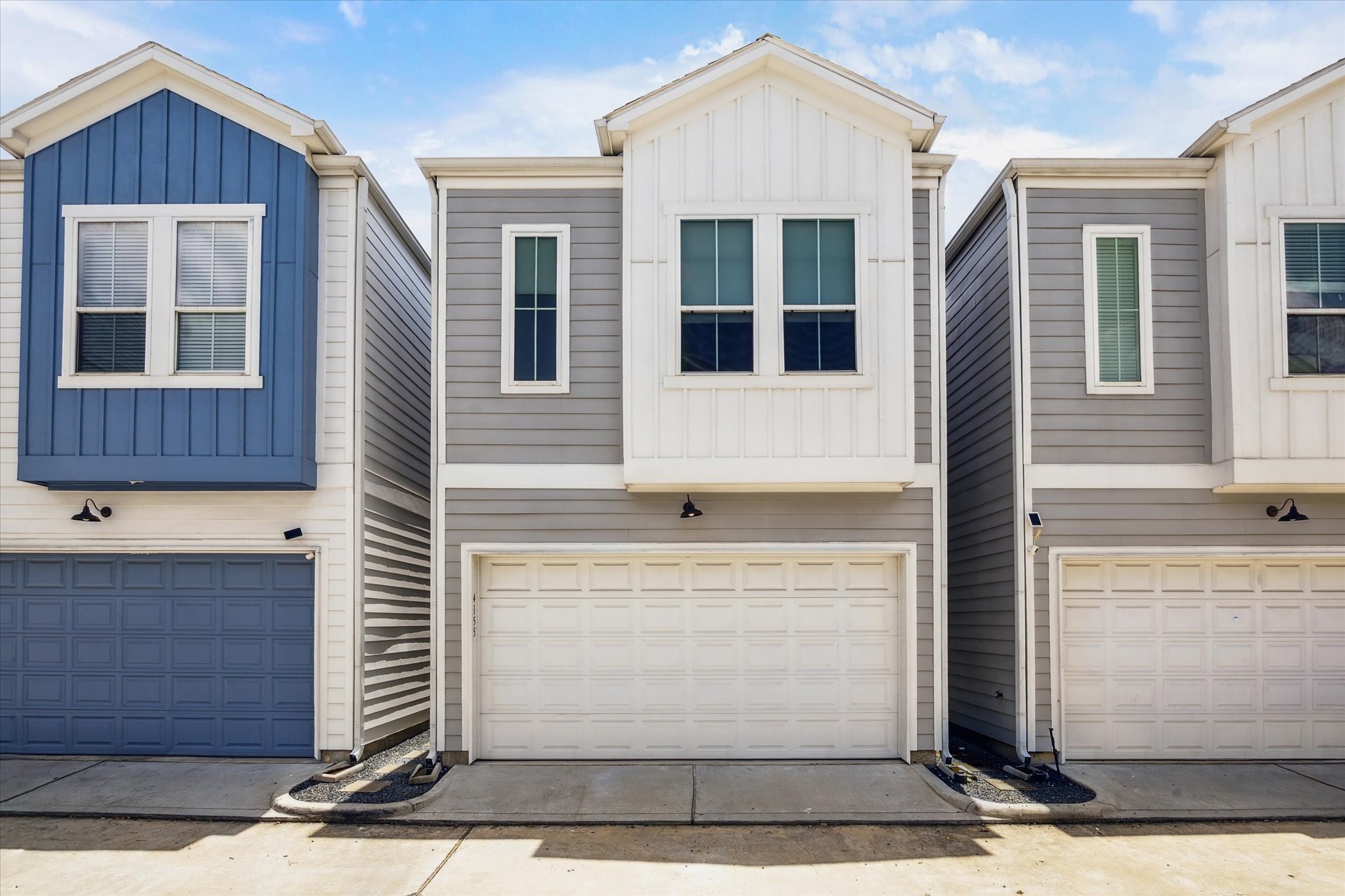 4155 Griggs Road Houston, TX 77021 - Photo 1 of 17 Contemporary 2-story home with a clean modern façade, two-car garage, and low-maintenance exterior—perfectly nestled in a gated community for easy urban living.