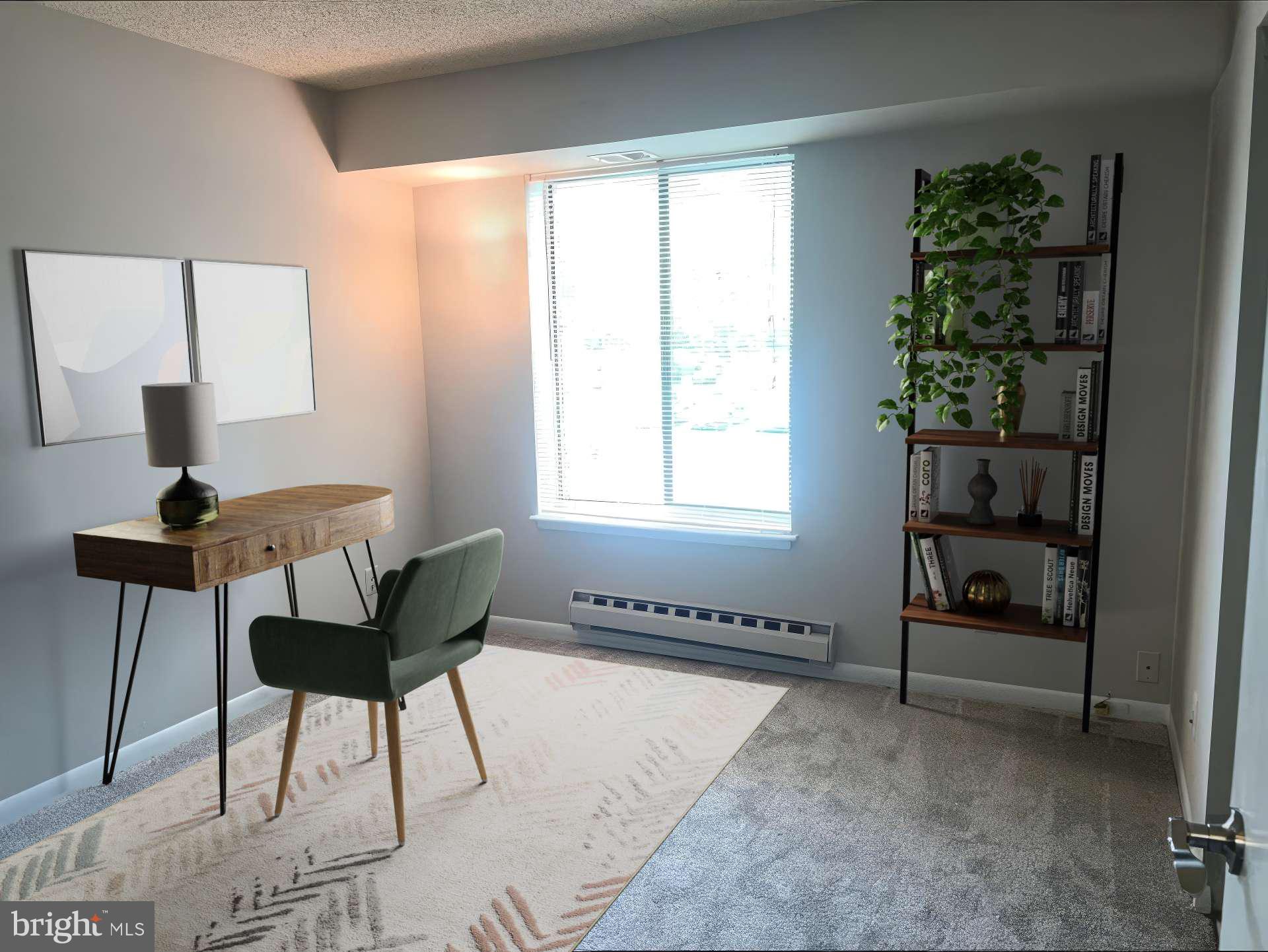 15300 Beaverbrook Court, Unit 882B Silver Spring, MD 20906 - Photo 24 of 44 a view of a workspace with furniture and a window