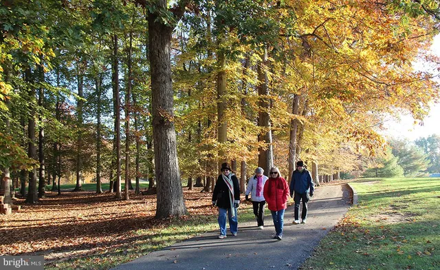 a large room with lots of furniture and wooden floor