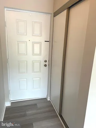 a view of an entryway with wooden floor