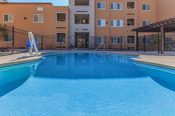 a view of a building with a swimming pool