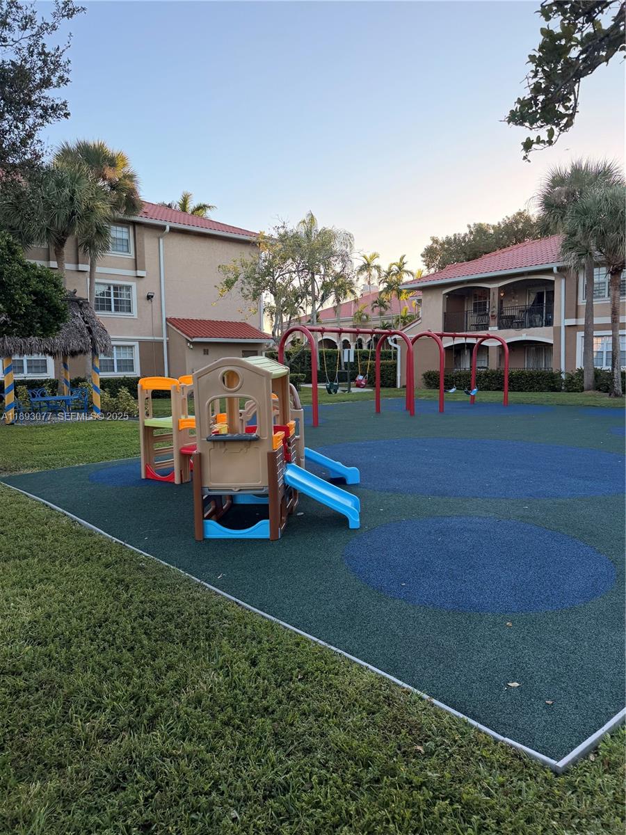 151 Southwest 117th Avenue, Unit 9108 Pembroke Pines, FL 33025 - Photo 7 of 12 a view of a house with backyard and porch