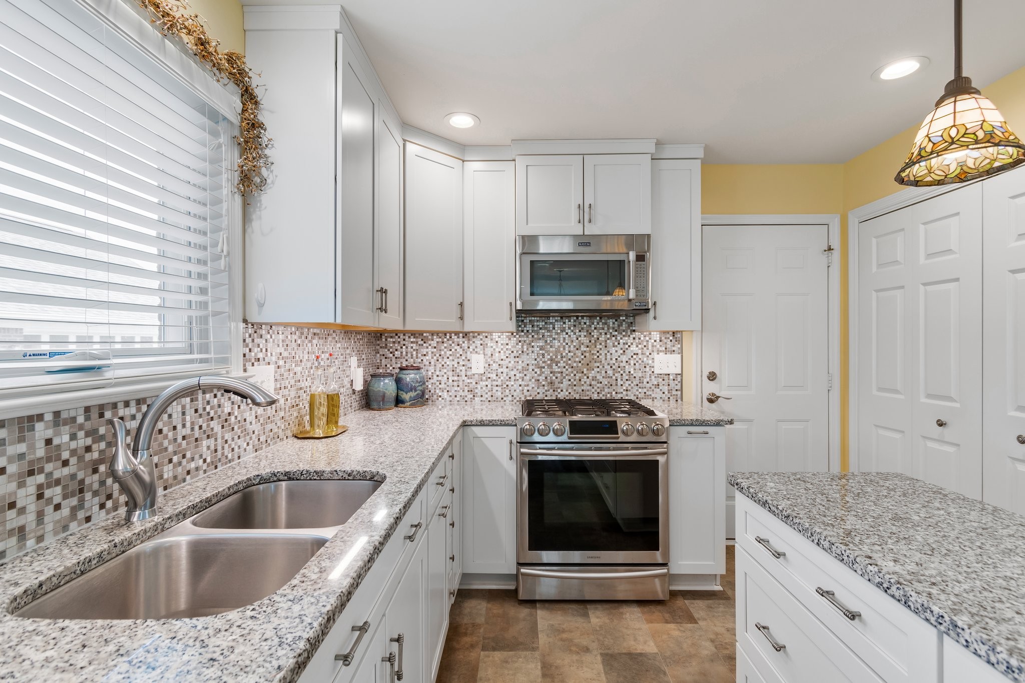 1922 Victorian Road Columbia, TN 38401 - Photo 11 of 25 a kitchen with a sink stove and cabinets