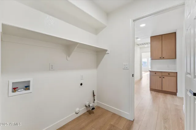 a view of a kitchen with wooden floor