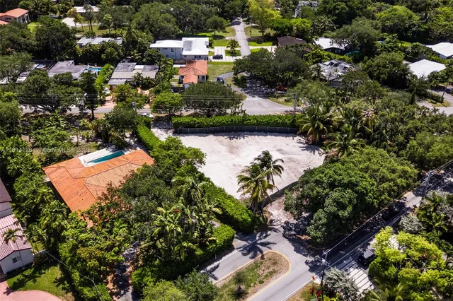 an aerial view of residential house with outdoor space and swimming pool
