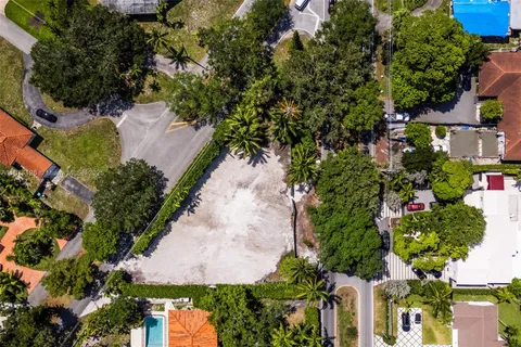 an aerial view of a house with a yard and garden