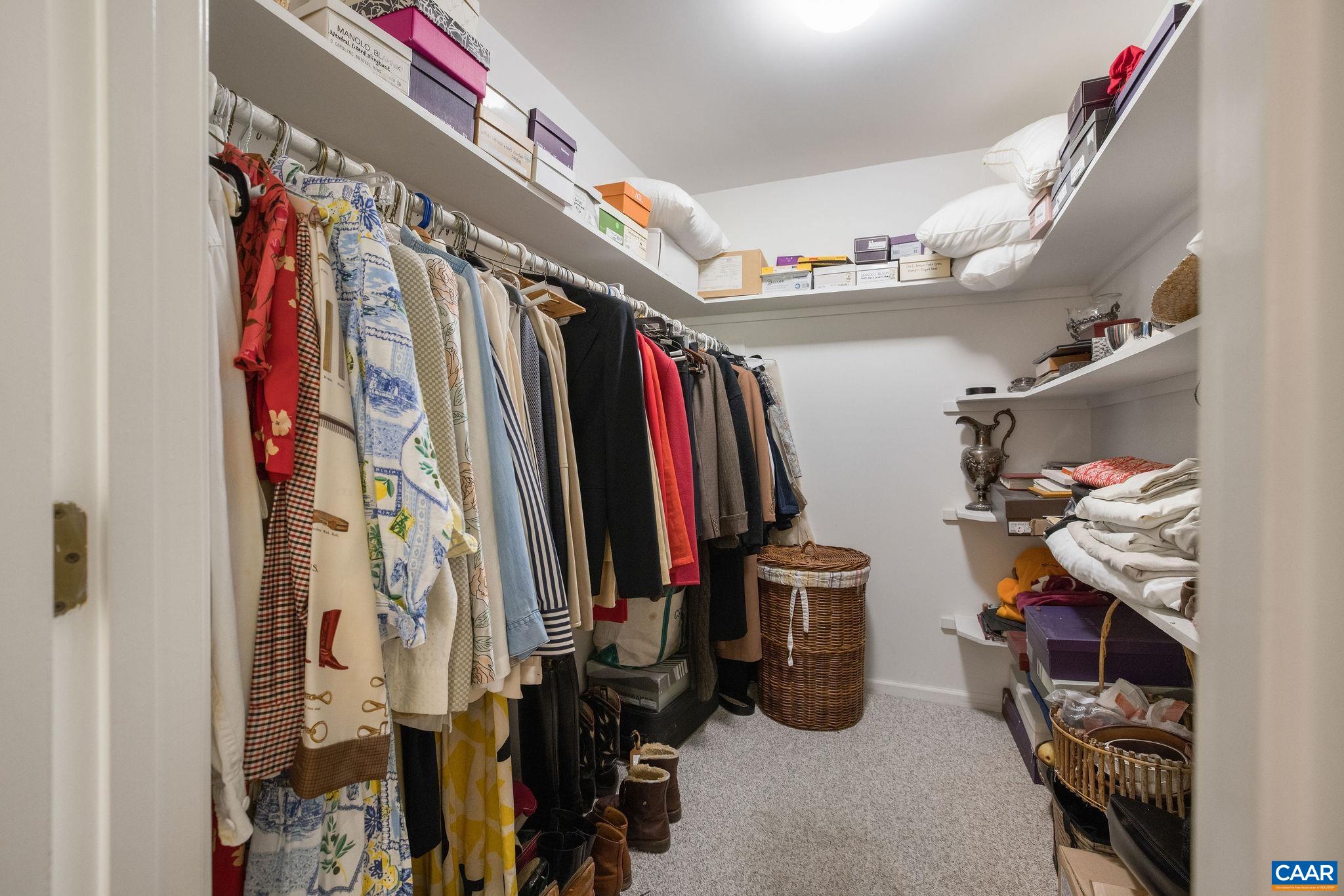 1249 Timberbranch Court Charlottesville, VA 22902 - Photo 17 of 34 a view of walk in closet with clothes and shoes