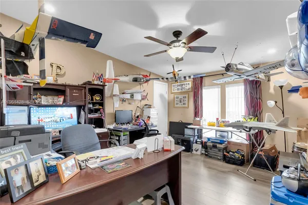 a living room with lots of furniture and a chandelier
