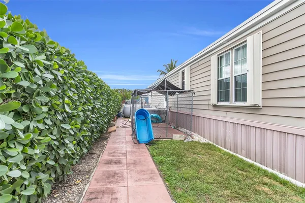 a view of a pathway with a backyard