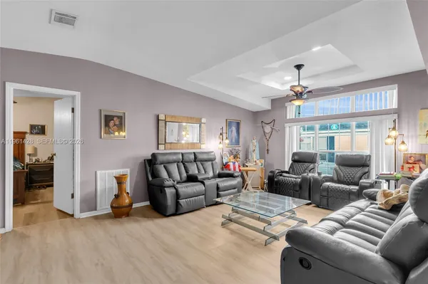 a living room with furniture and a window