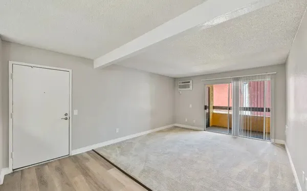 a view of kitchen and empty room