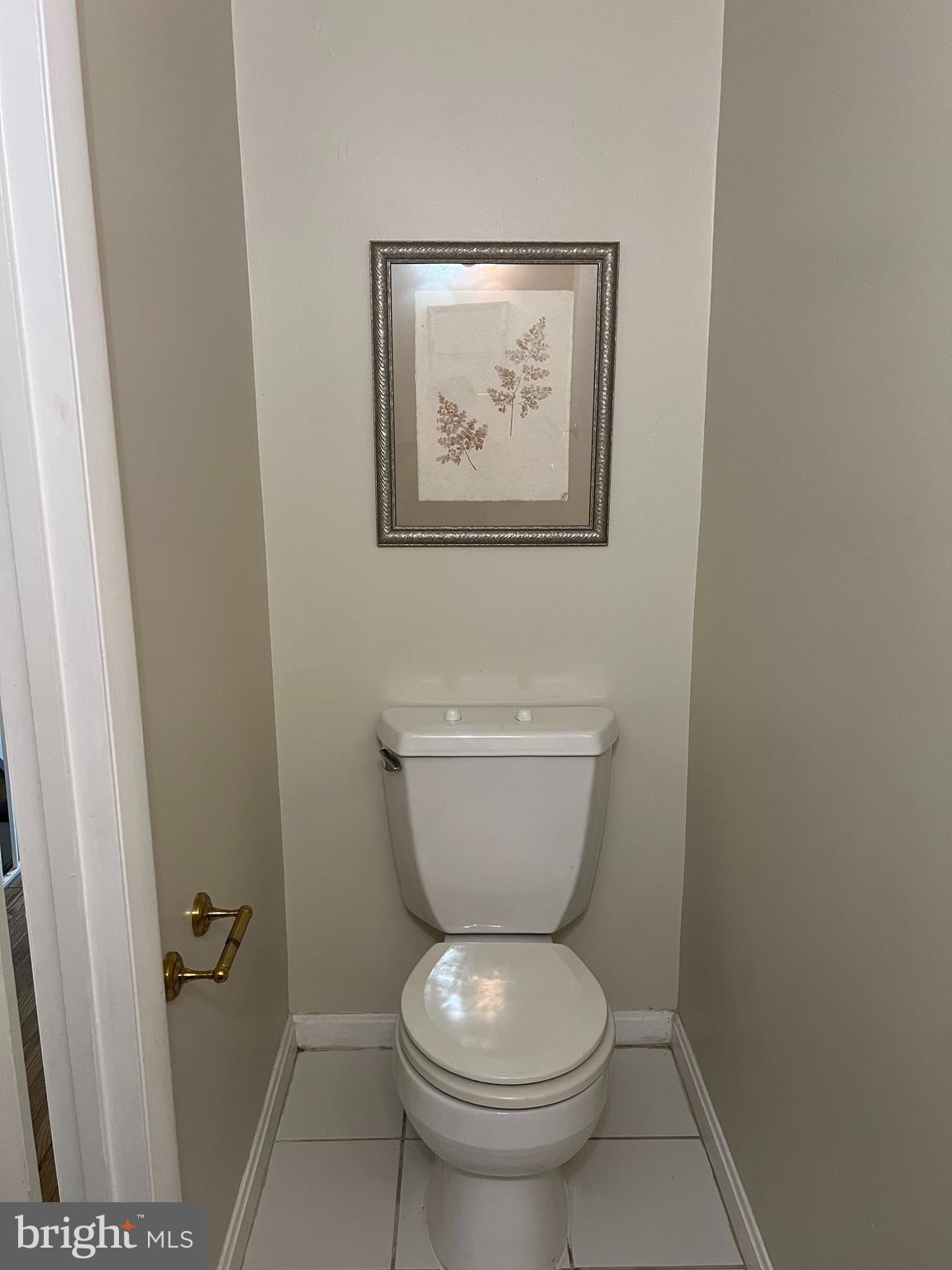 2040 Golf Course Drive Reston, VA 20191 - Photo 12 of 34 a bathroom with a toilet and a painting on the wall