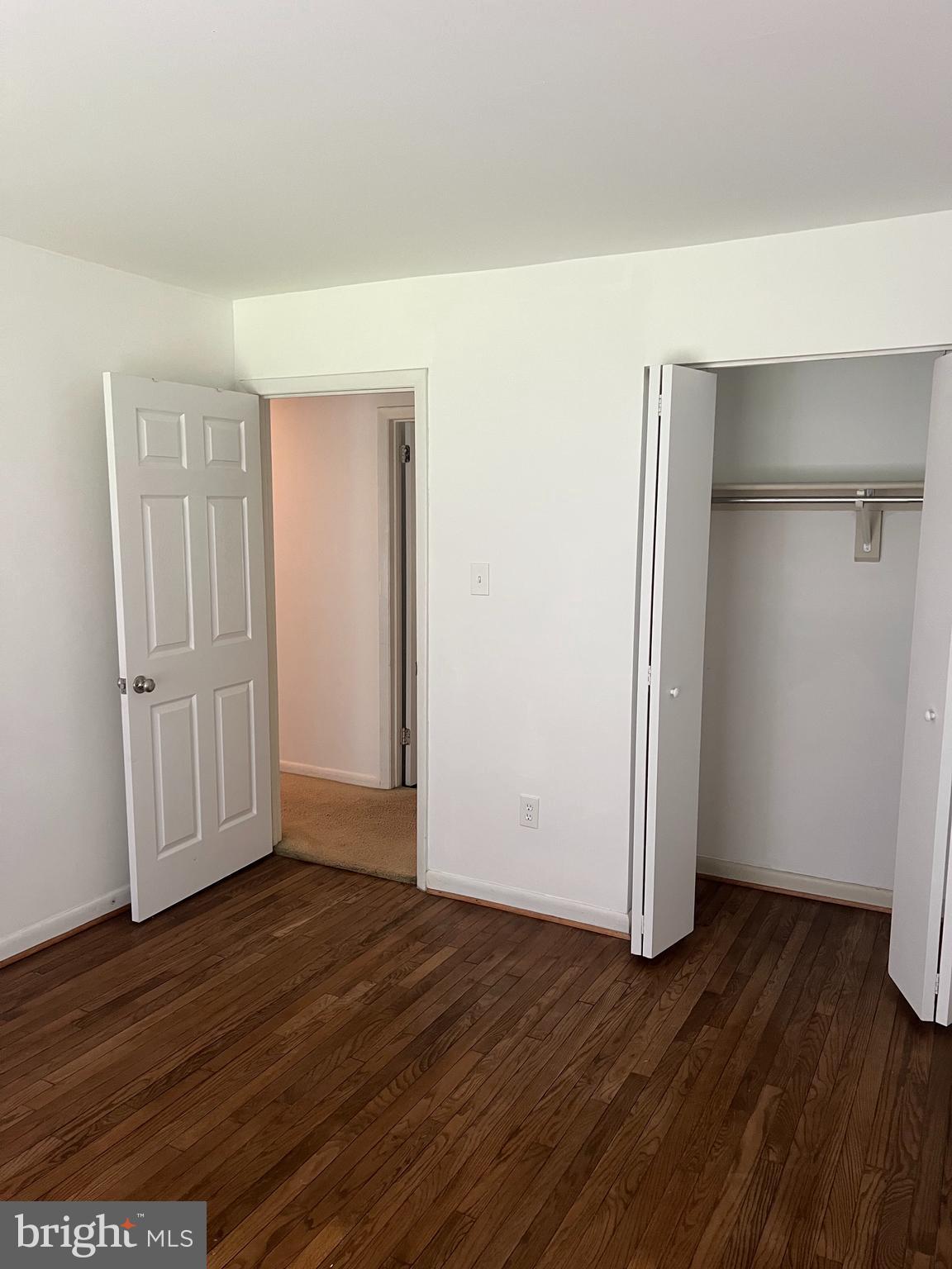2040 Golf Course Drive Reston, VA 20191 - Photo 18 of 34 an empty room with wooden floor and closet area