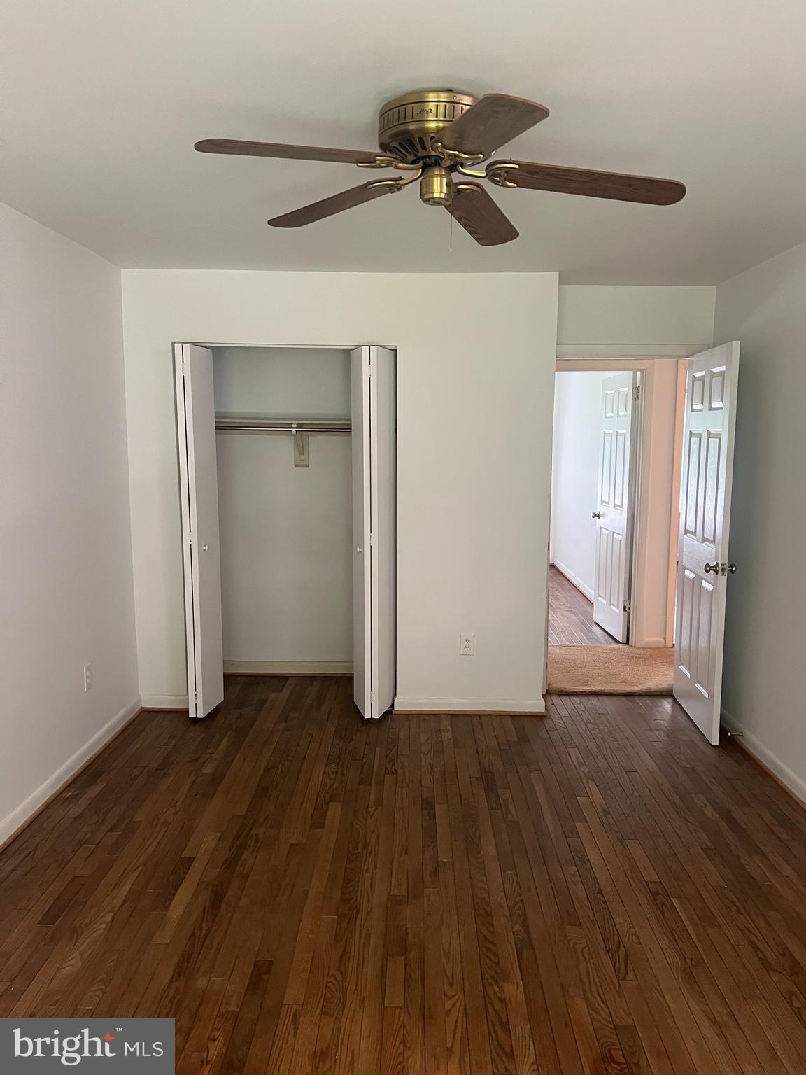 2040 Golf Course Drive Reston, VA 20191 - Photo 20 of 34 a view of an empty room with wooden floor and a window