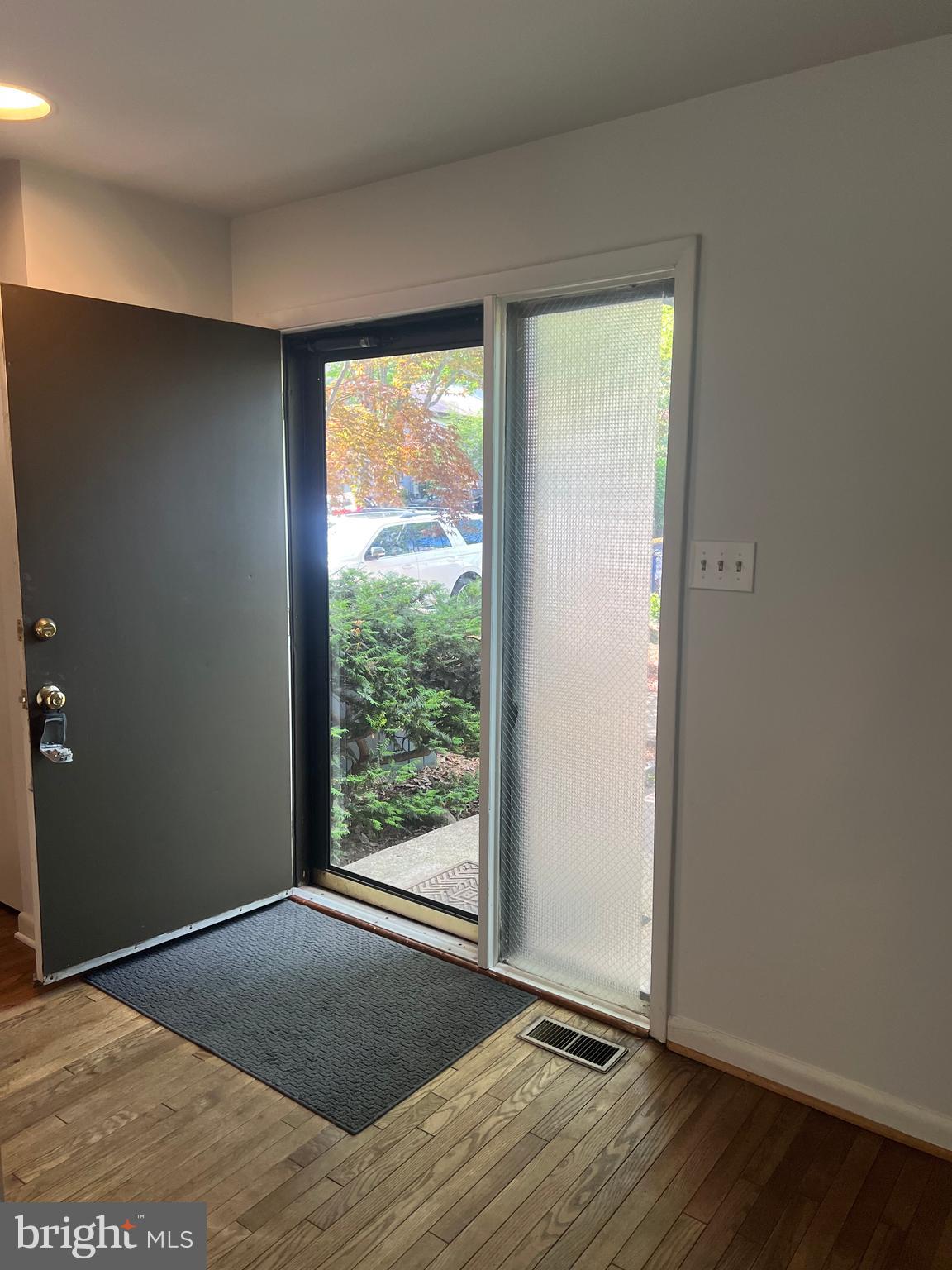 2040 Golf Course Drive Reston, VA 20191 - Photo 2 of 34 an empty room with wooden floor and windows