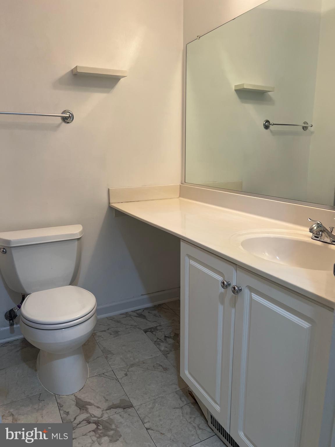 2040 Golf Course Drive Reston, VA 20191 - Photo 22 of 34 a bathroom with a sink and a toilet