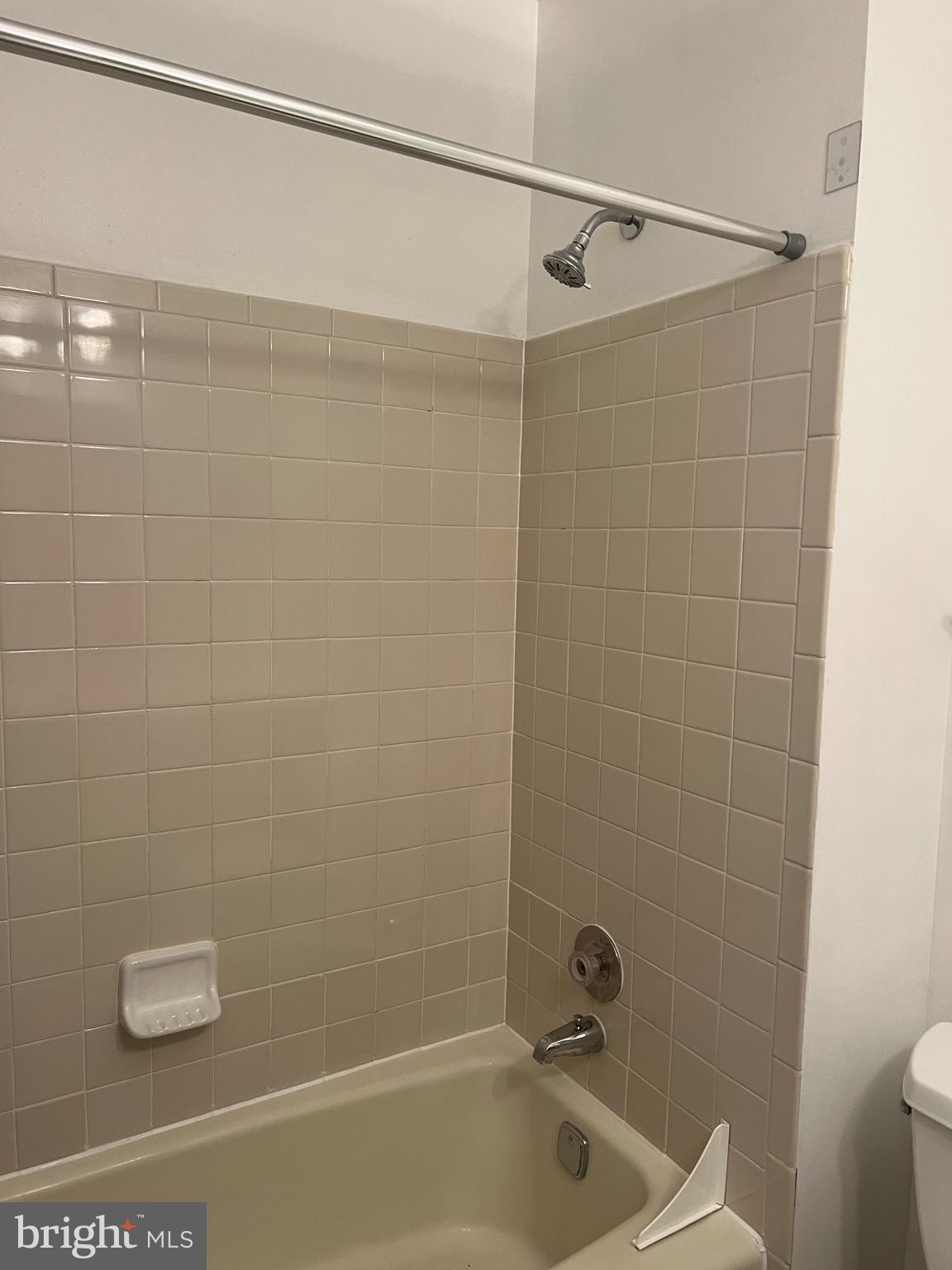 2040 Golf Course Drive Reston, VA 20191 - Photo 23 of 34 a bathroom with a shower and a bathtub