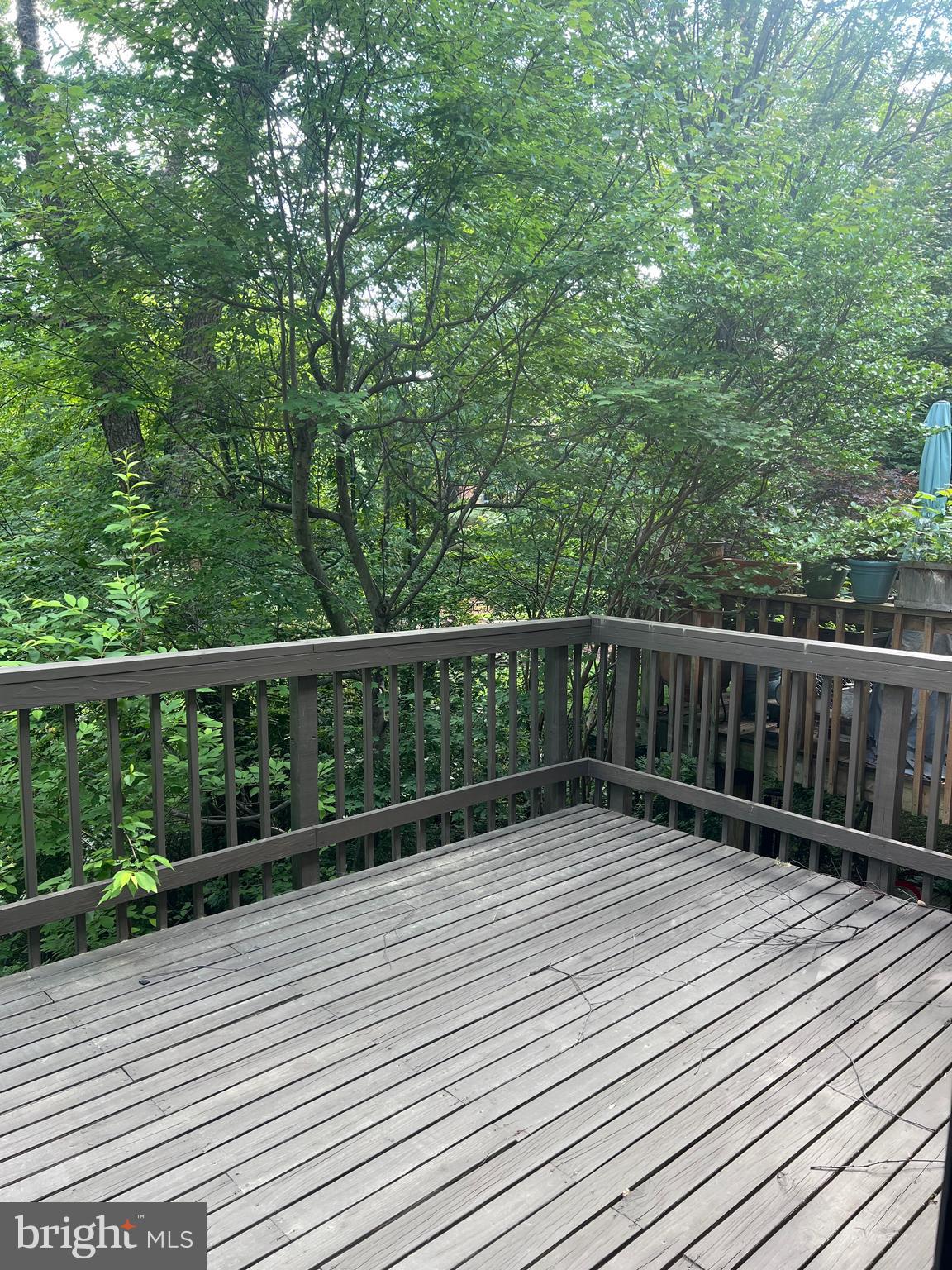 2040 Golf Course Drive Reston, VA 20191 - Photo 34 of 34 a view of balcony with wooden floor and fence