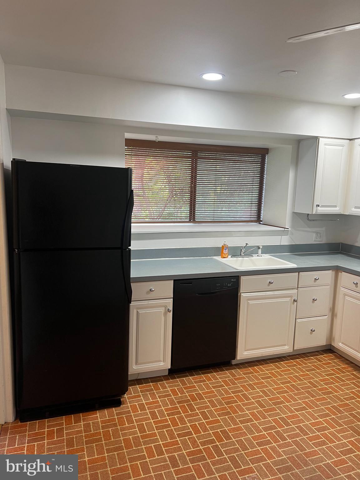 2040 Golf Course Drive Reston, VA 20191 - Photo 9 of 34 a kitchen with stainless steel appliances granite countertop a refrigerator and a stove