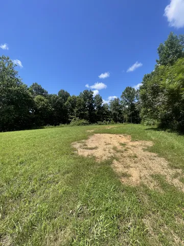 a view of a field with an outdoor space