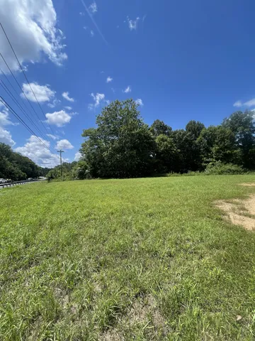 a view of a golf course with a lake