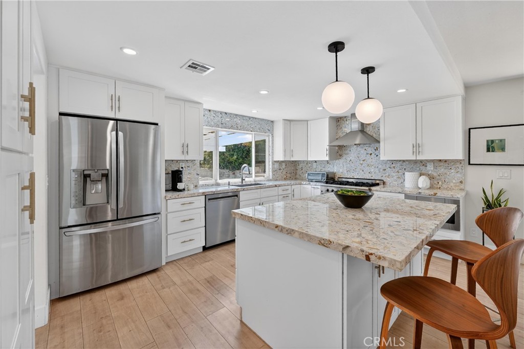 945 Le Conte Drive Riverside, CA 92507 - Photo 15 of 36 Stainless Appliances, Woo Laminate Flooring, Canned lighting, beautiful view of backyard
