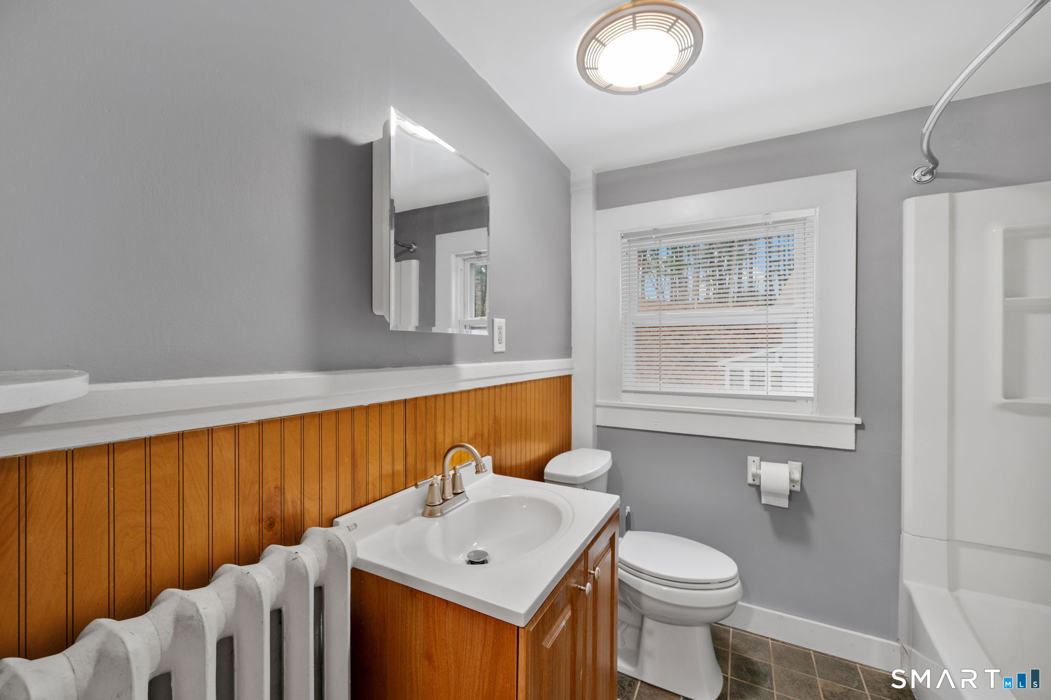 37 Bushy Hill Road Simsbury, CT 06070 - Photo 18 of 23 a bathroom with a sink a toilet and mirror