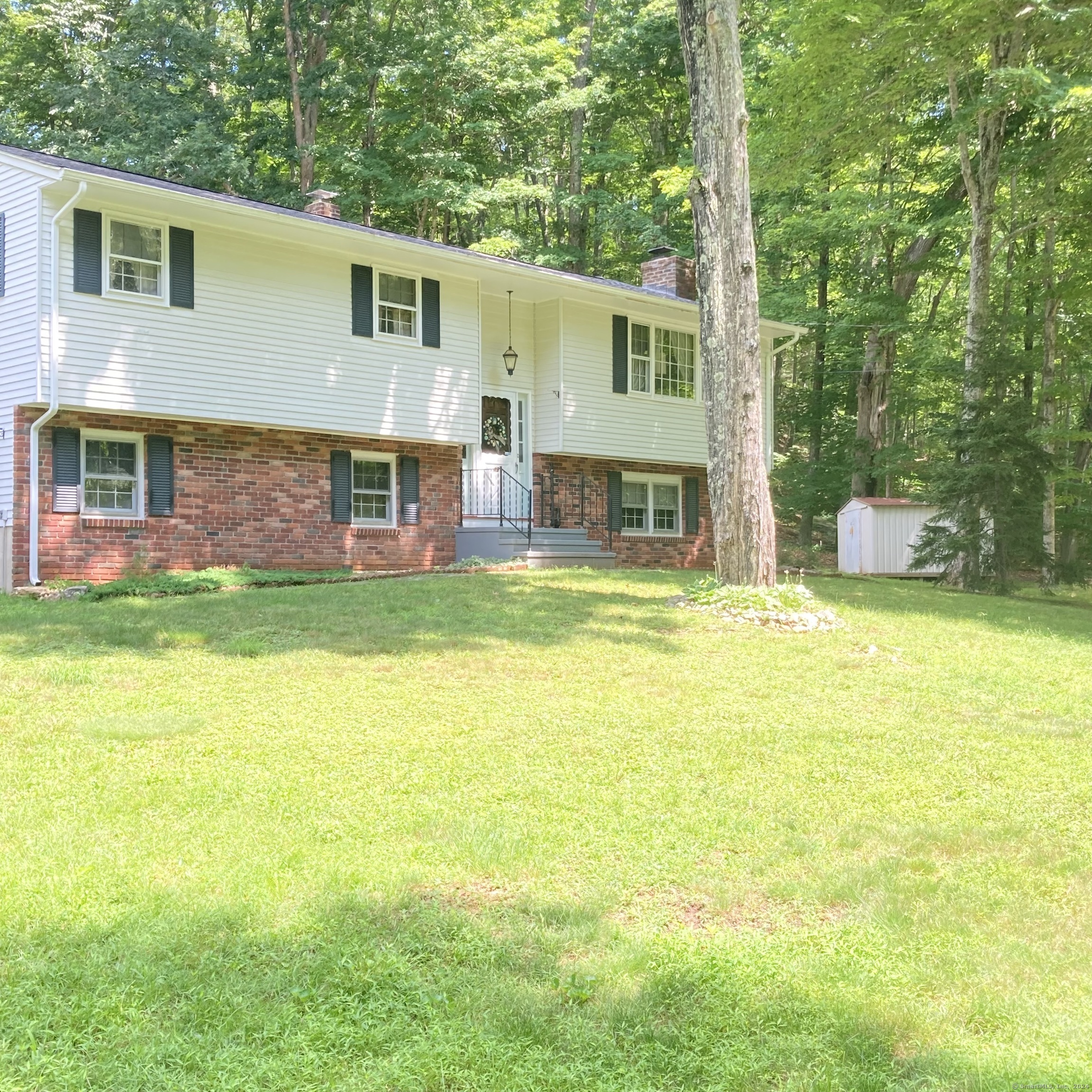 42 Valley Road Clinton, CT 06413 - Photo 1 of 1 a view of a house with a yard patio and a swimming pool