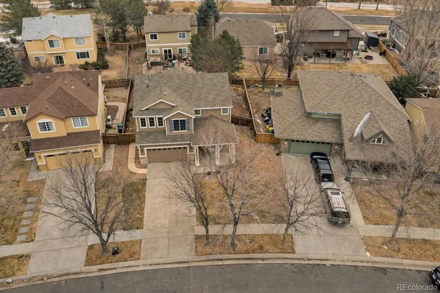 an aerial view of residential houses with outdoor space