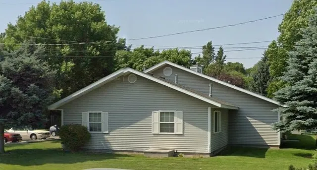 a view of a house with a yard