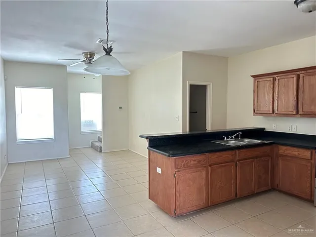 a white toilet sitting next to a bath tub