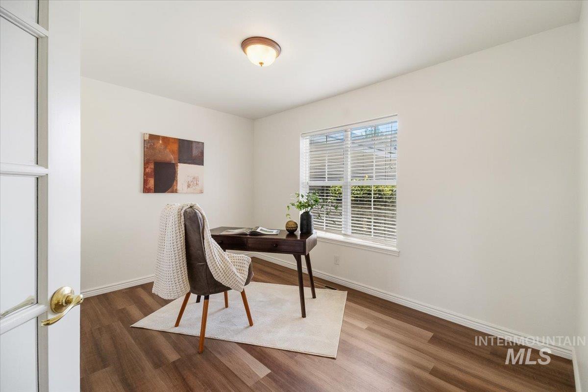 2032 Talus Loop Twin Falls, ID 83301 - Photo 7 of 43 Room featuring wood-finish flooring, white baseboards, and a window with blinds