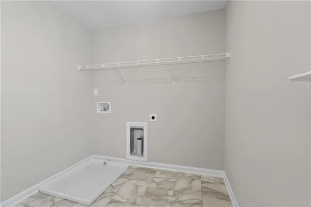 a view of a livingroom with a ceiling fan & entryway
