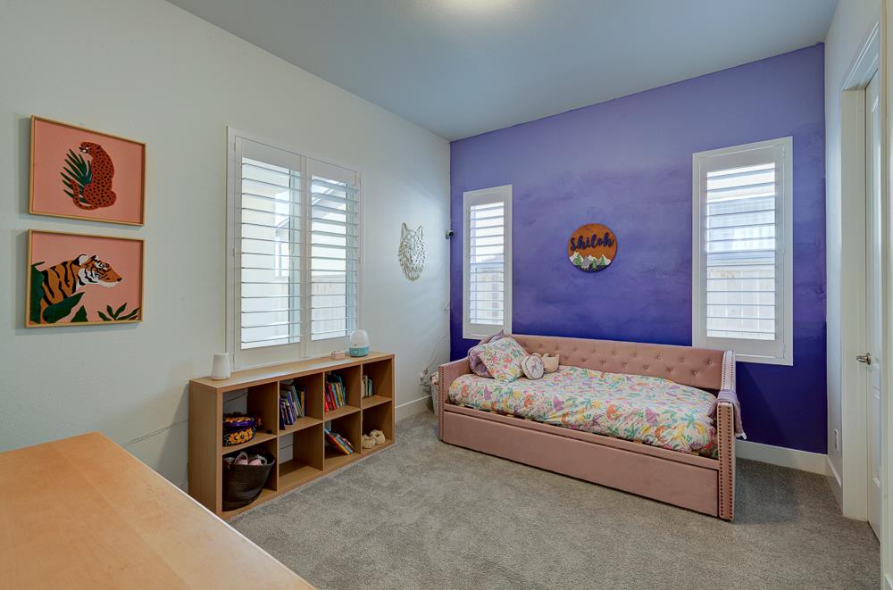 1048 Beaver Pond Loop Madera, CA 93636 - Photo 18 of 27 a bedroom with a bed and a window