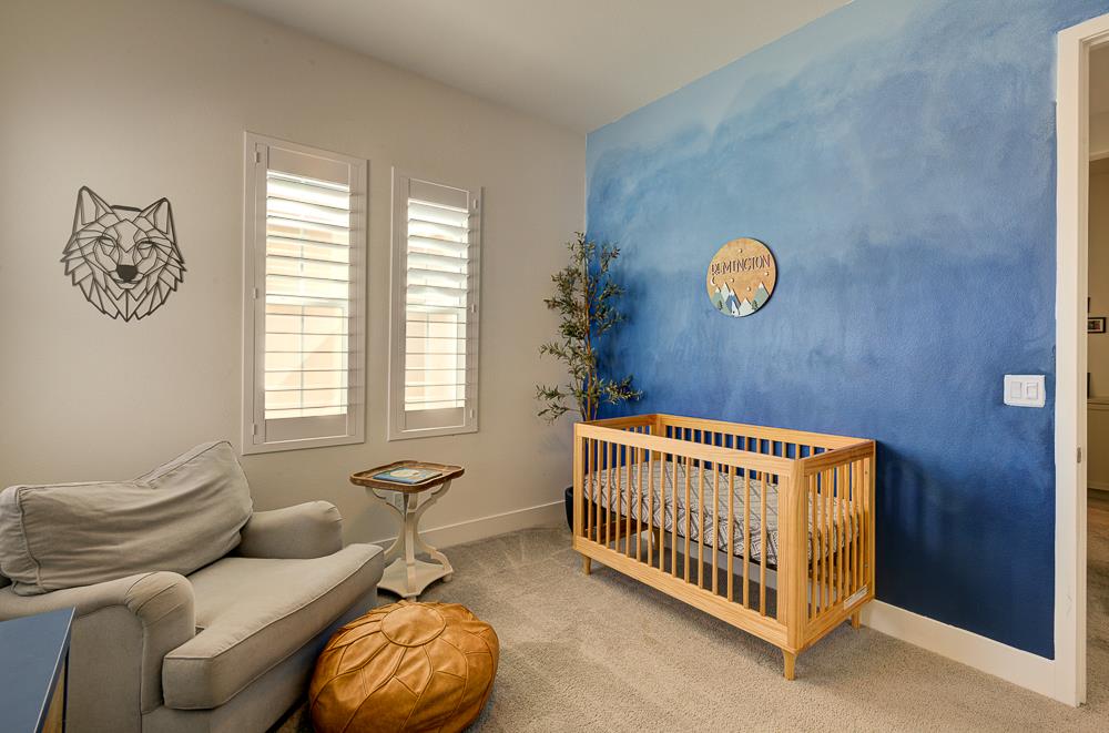 1048 Beaver Pond Loop Madera, CA 93636 - Photo 20 of 27 a bedroom with furniture and a window