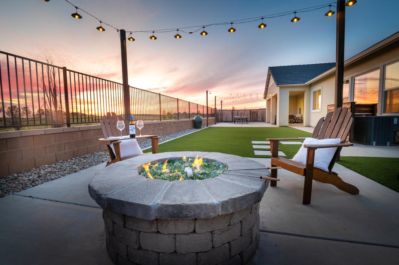 1048 Beaver Pond Loop Madera, CA 93636 - Photo 2 of 27 a view of a dining room with furniture window and outside view