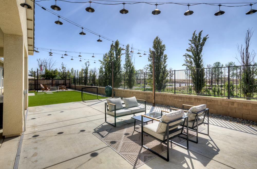 1048 Beaver Pond Loop Madera, CA 93636 - Photo 24 of 27 a view of a terrace with sitting area