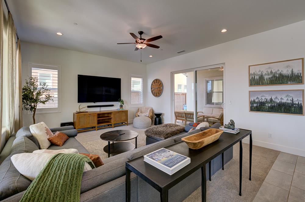1048 Beaver Pond Loop Madera, CA 93636 - Photo 7 of 27 a living room with furniture and a flat screen tv