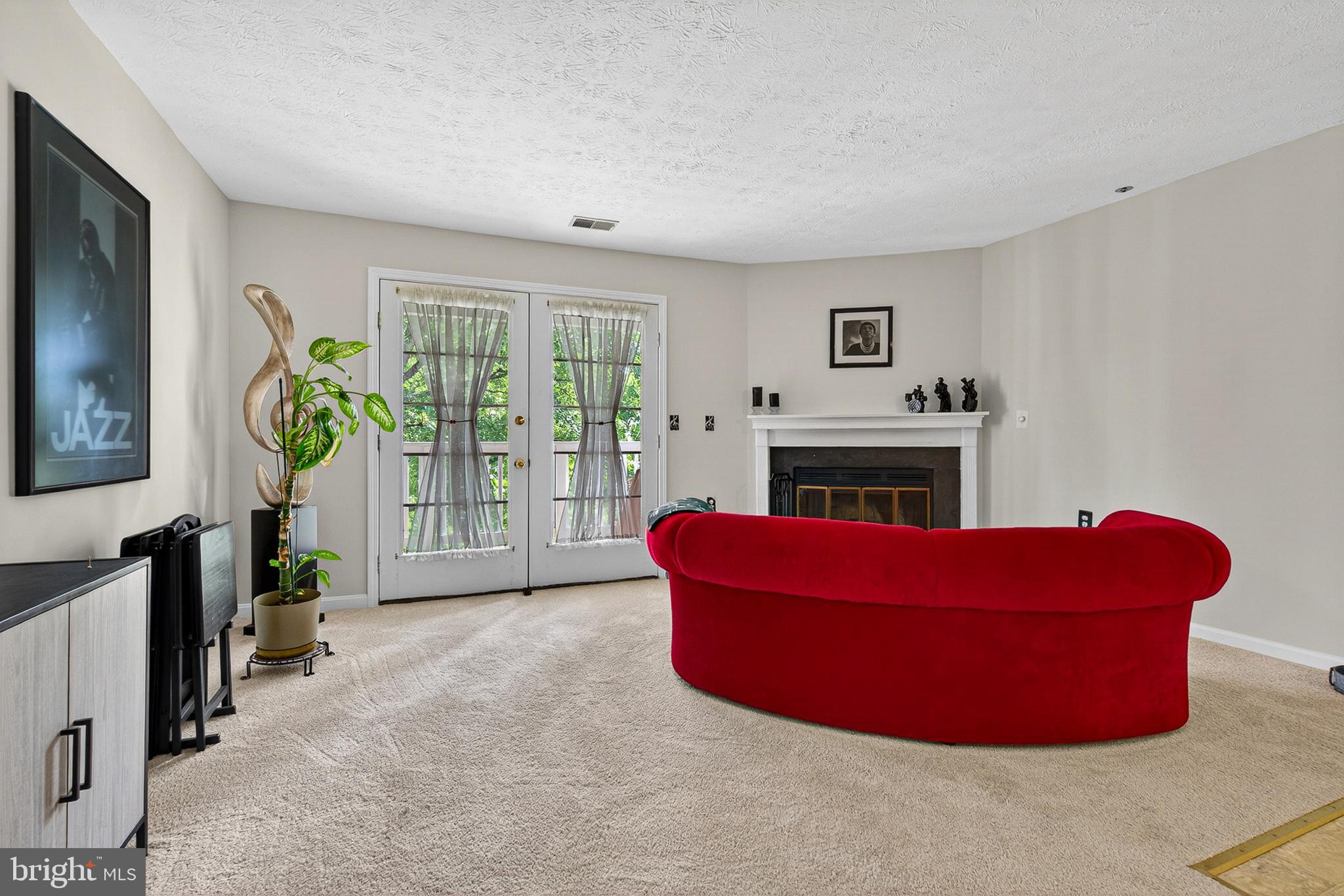 6415 Greenfield Road, Unit 1303 Elkridge, MD 21075 - Photo 4 of 25 Living Room with doors to Balcony