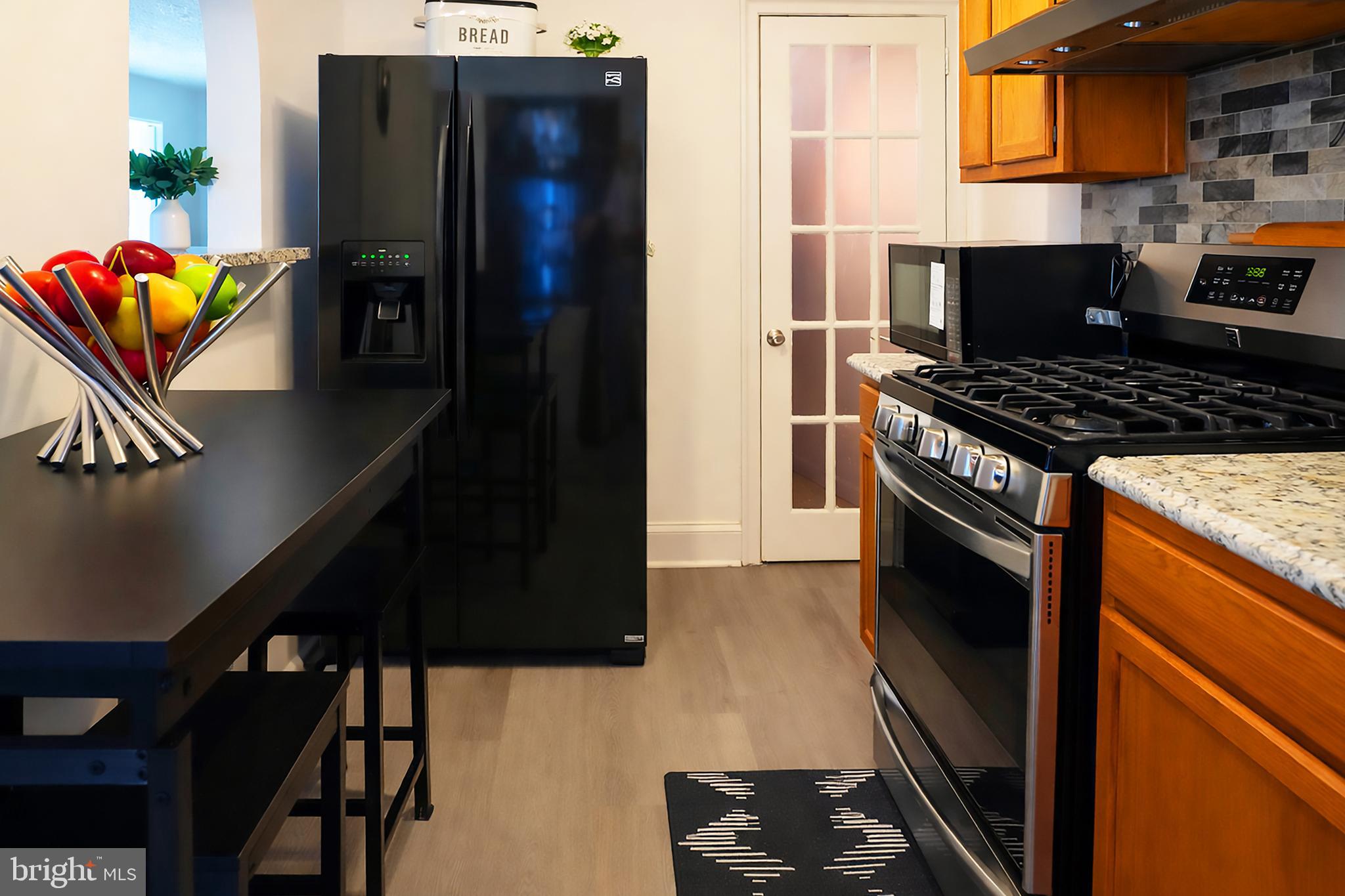 3935 Clay Place Northeast Washington, DC 20019 - Photo 6 of 17 a kitchen with stainless steel appliances granite countertop a stove a refrigerator and a stove