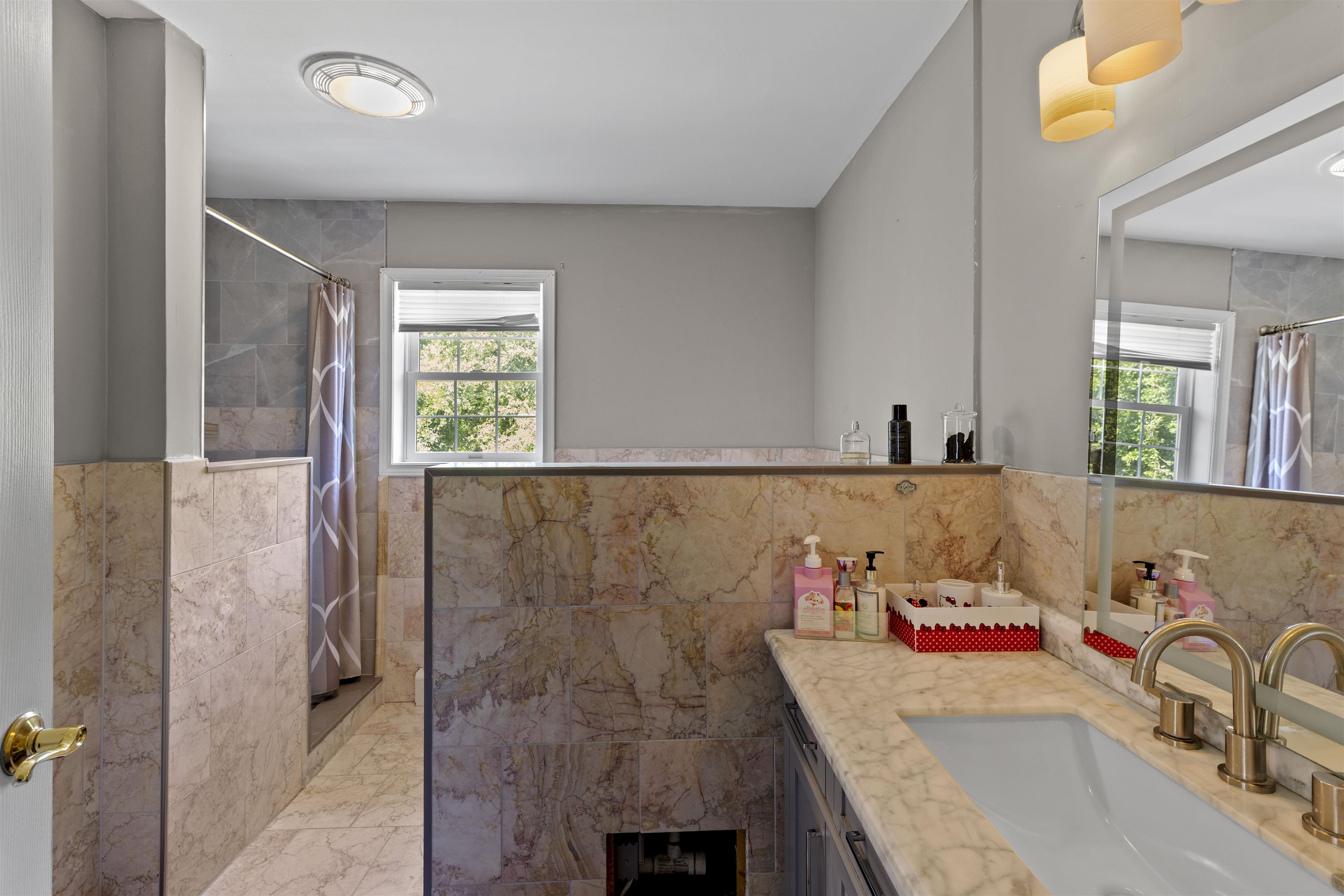 551 Shunpike Road Cape May Court House, NJ 08210 - Photo 22 of 47 a bathroom with a tub sink and mirror