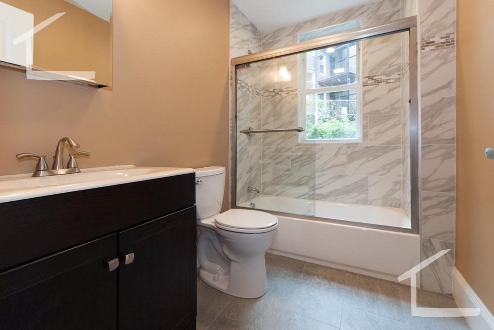 6 Lothian Road, Unit 2 Boston, MA 02135 - Photo 10 of 10 a bathroom with a sink a toilet and a shower
