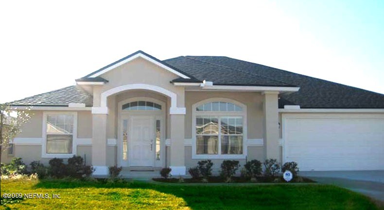 1985 Derringer Road Jacksonville, FL 32225 - Photo 1 of 1 a front view of a house with a yard