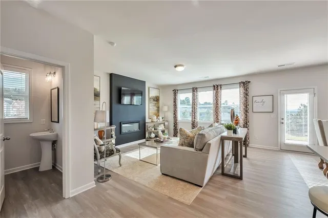 a living room with furniture and a large window