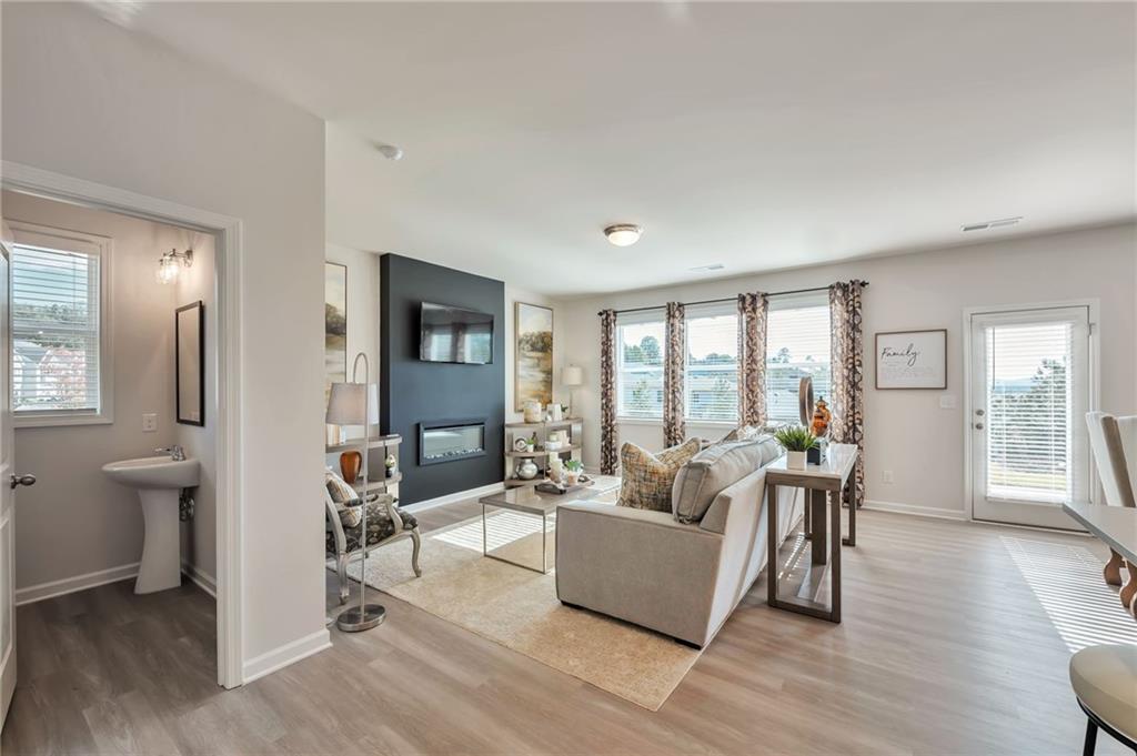104 Windmill Court Calhoun, GA 30701 - Photo 9 of 23 a living room with furniture and a large window