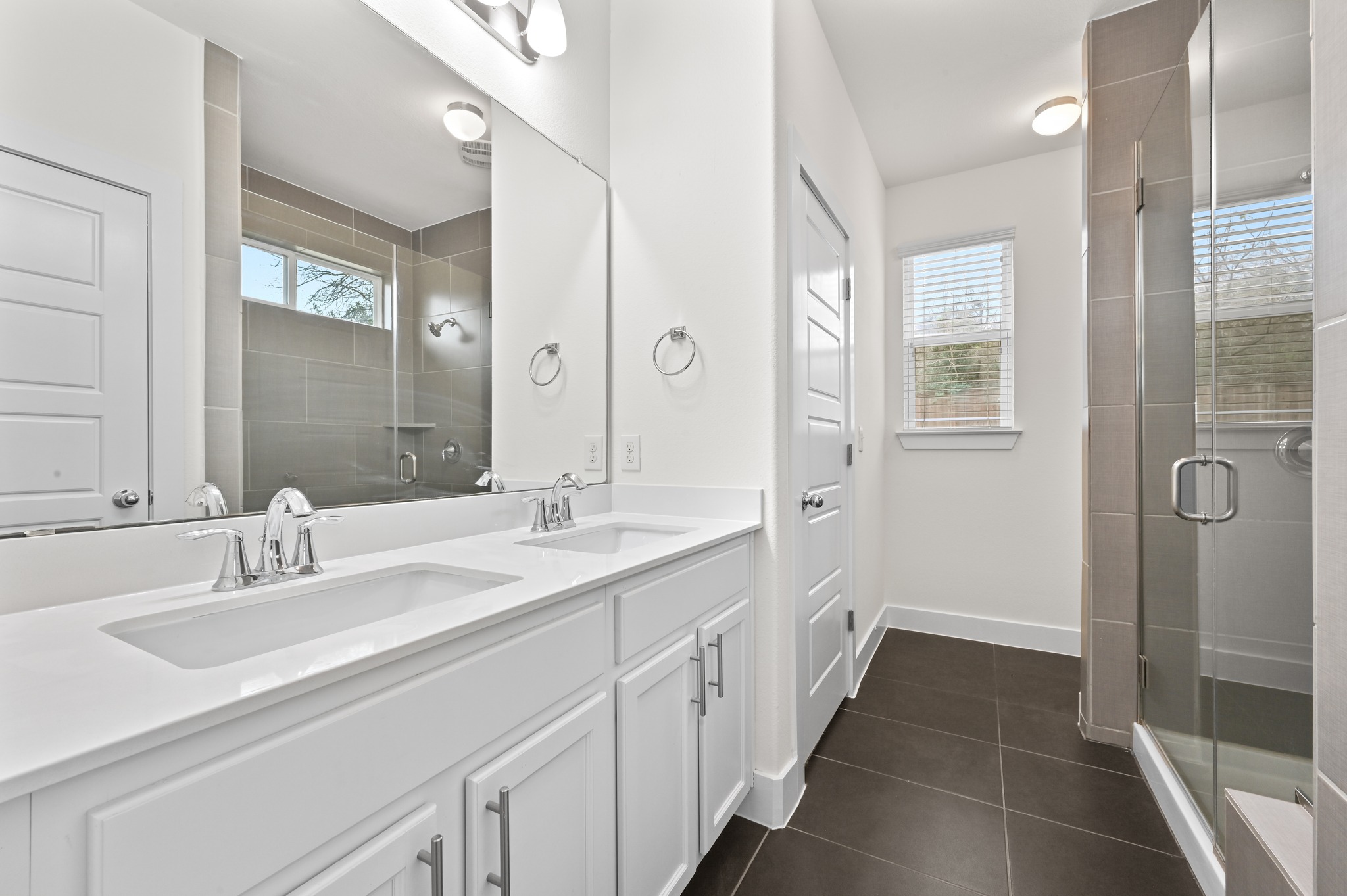 2204 Theseus Pass Austin, TX 78741 - Photo 16 of 31 a bathroom with a double vanity sink and mirror